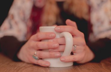 Hands holding a mug