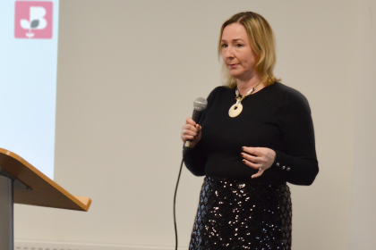 Lady from the British Chambers of Commerce presenting holding a microphone