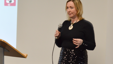 Lady from the British Chambers of Commerce presenting holding a microphone