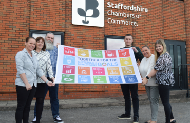 Staffordshire Chambers team pictured outside of their offices with the Sustainable Development Goals flag
