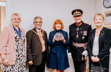 Sara Williams, Chief Executive Officer of Staffordshire Chambers with Ian Dudson, Lord-Lieutenant for Staffordshire presenting a King's Award to Sara