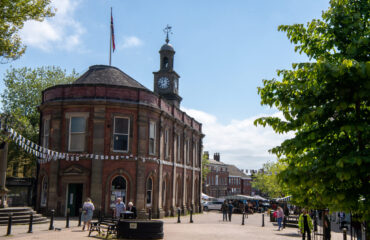 Newcastle-under-Lyme City Centre surrounded by shops, marquees and many shoppers