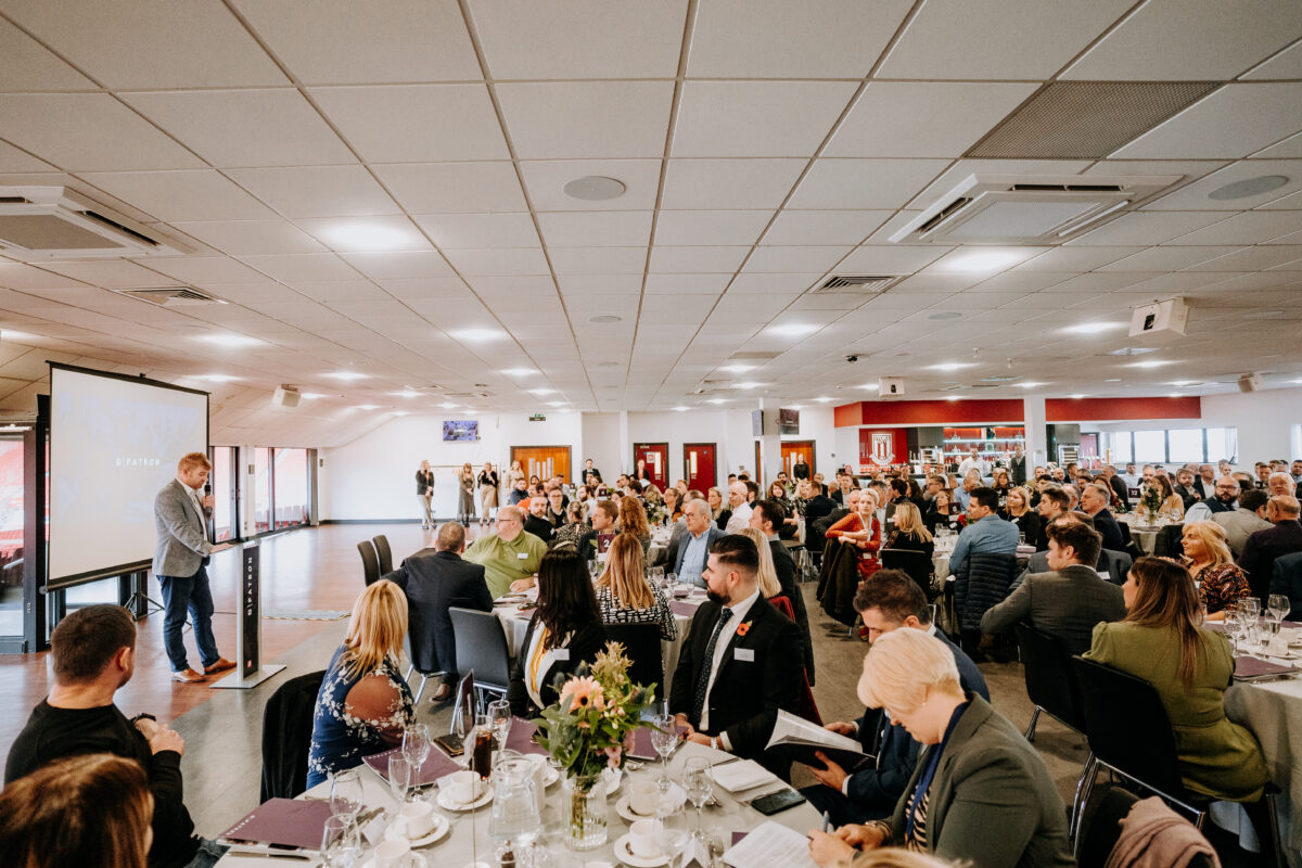 Picture of Chris Prat talking to people at a Staffordshire chambers of commerce event.