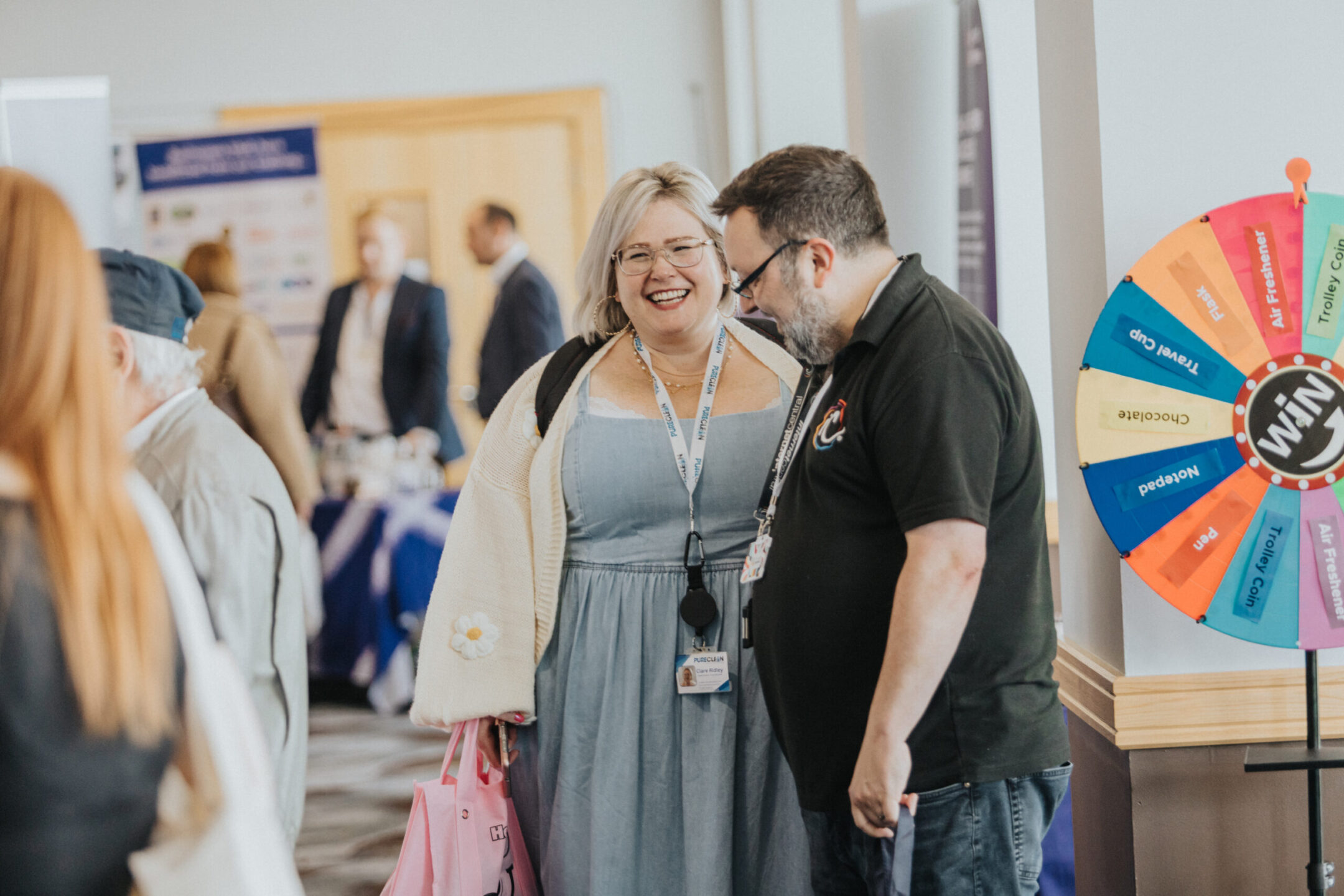 Two people talking to each other at lets dp buisness 2025 expo event.